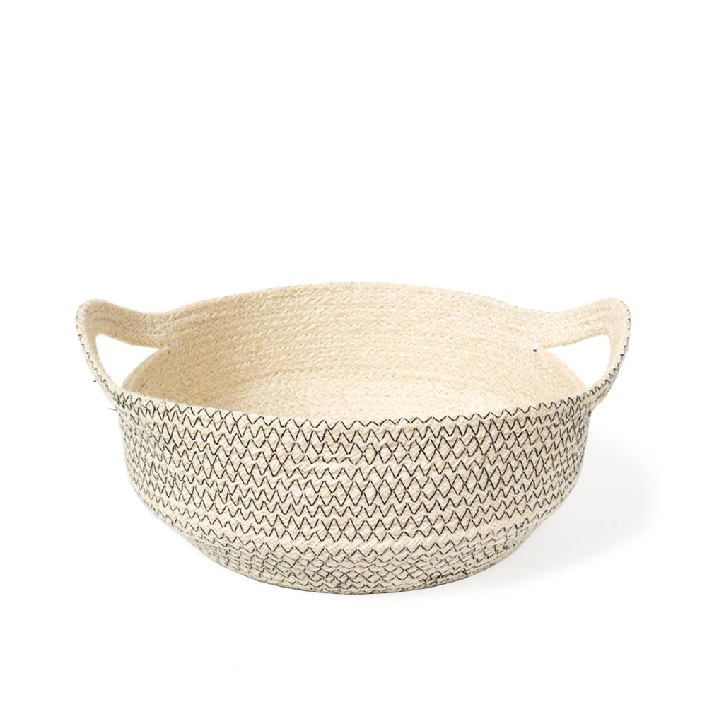
                      
                        Woven basket with a zigzag stitching pattern on a white background
                      
                    