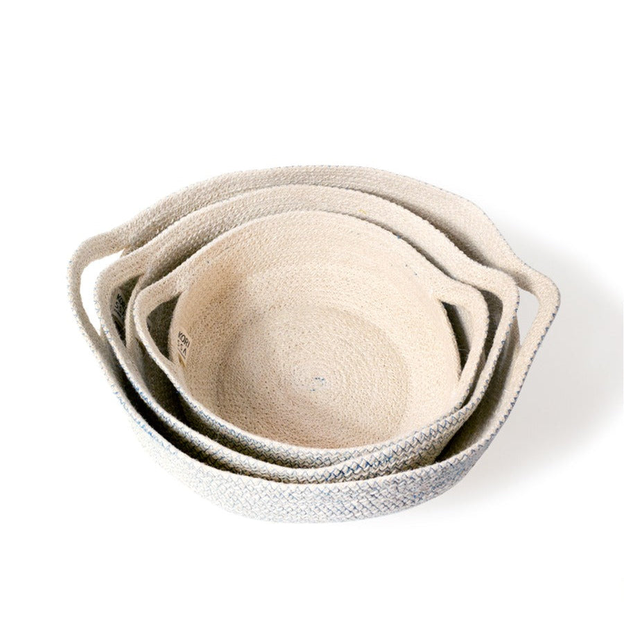 
                      
                        Set of three woven baskets with blue stitching on a white background
                      
                    