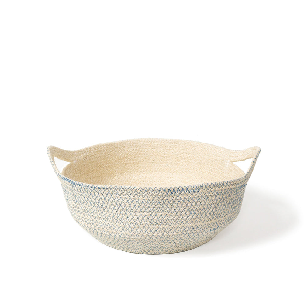 
                      
                        A round, handwoven jute basket with blue stitching displayed against a white background.
                      
                    