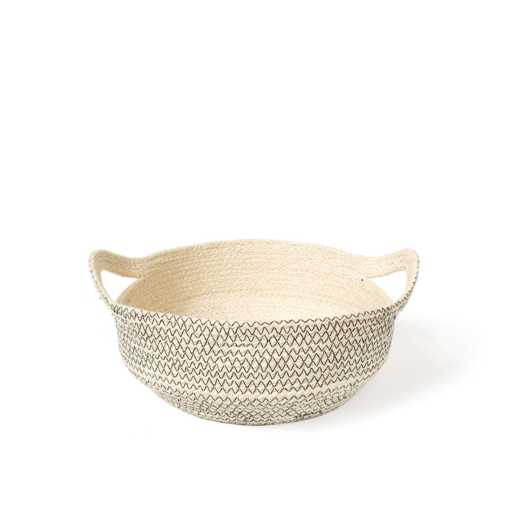 
                      
                        Woven basket with a zigzag stitching pattern on a white background
                      
                    
