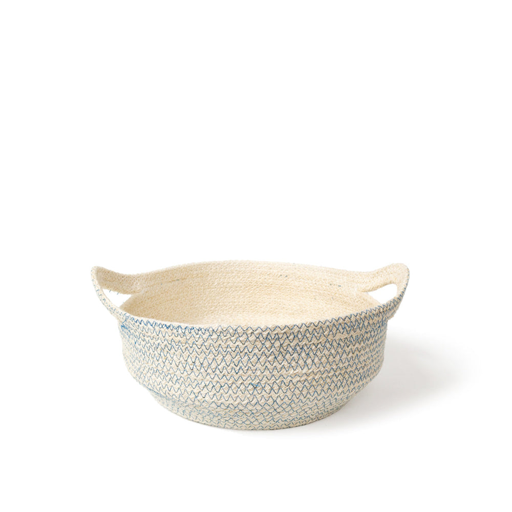 
                      
                        A round, handwoven jute basket with blue stitching displayed against a white background.
                      
                    