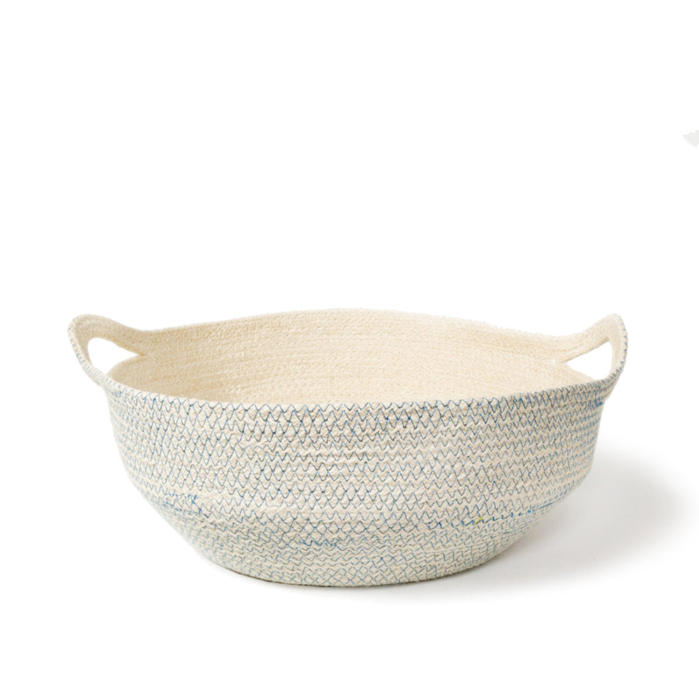
                      
                        A round, handwoven jute basket with blue stitching displayed against a white background.
                      
                    