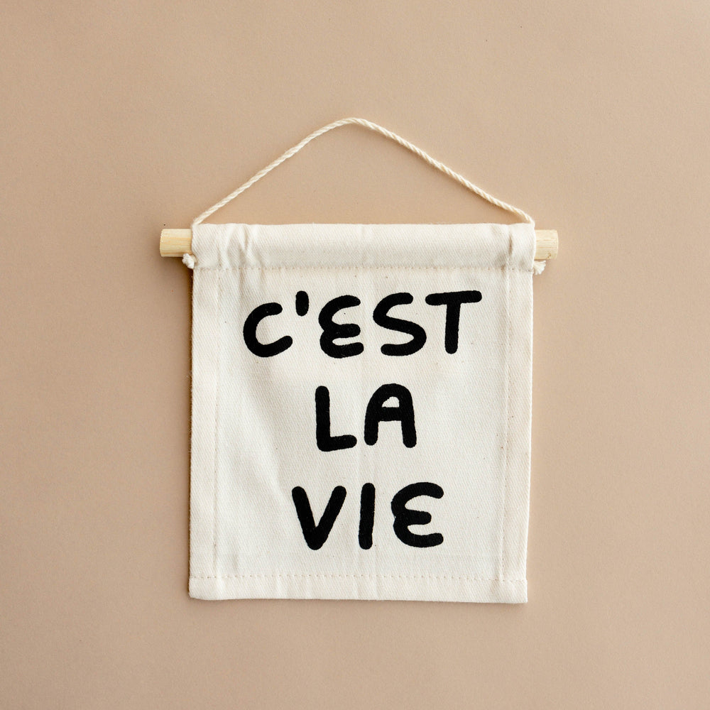 
                      
                        "C'est La Vie" Hang Sign
                      
                    