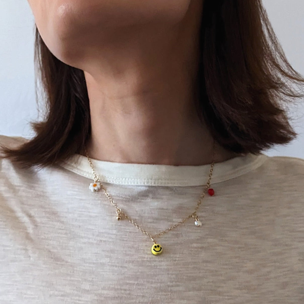 
                      
                        Multi Charm Necklace
                      
                    