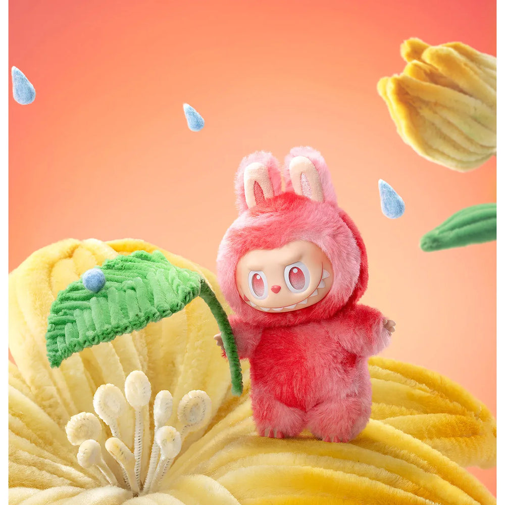 
                      
                        The MONSTERS Big Into Energy Series - LOVE Labubu standing on a yellow floral background with raindrops.
                      
                    