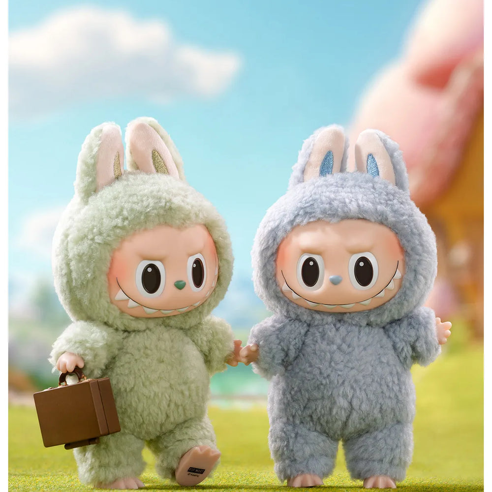 
                      
                        The MONSTERS Exciting Macaron series Labubus standing on grass with a blue sky background.
                      
                    