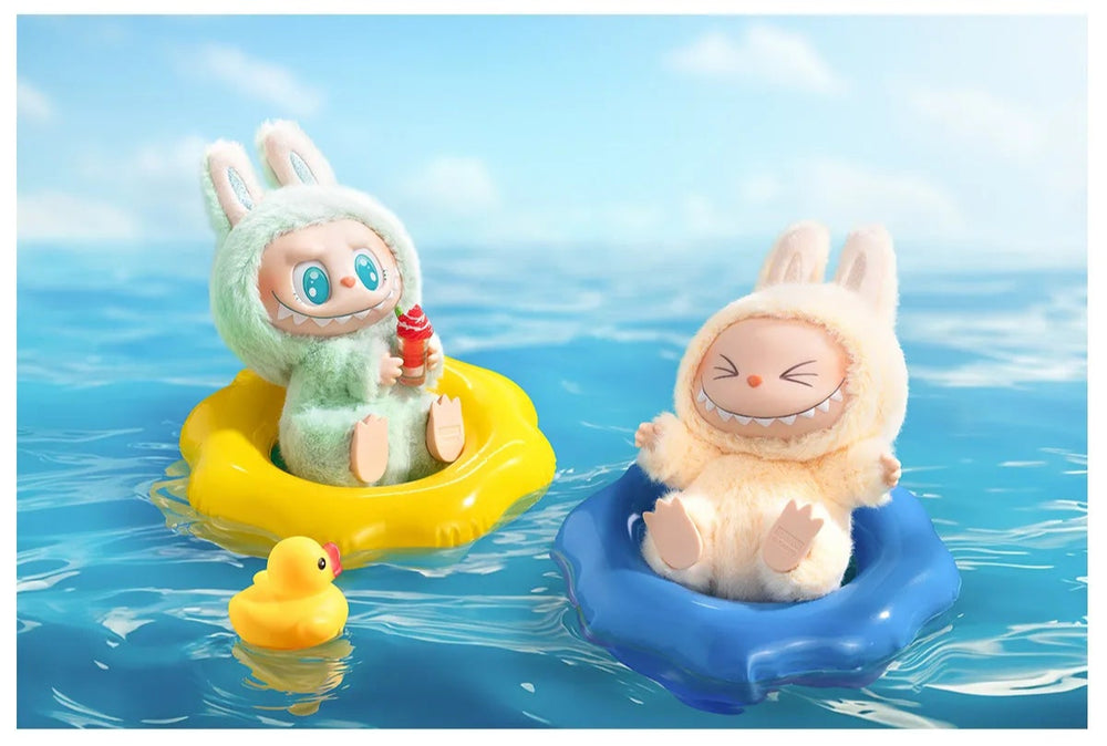 
                      
                        Two labubus from the MONSTERS Have A Seat collection on floaties next to a rubber ducky.
                      
                    
