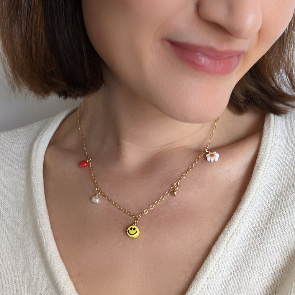 
                      
                        Multi Charm Necklace
                      
                    