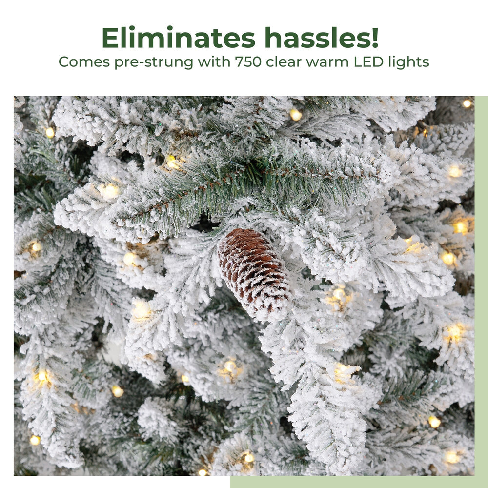
                      
                        11’ Flocked Livingston Fir Artificial Christmas Tree with Pine Cones, 950 Clear Warm LED Lights and 3016 Bendable Branches
                      
                    