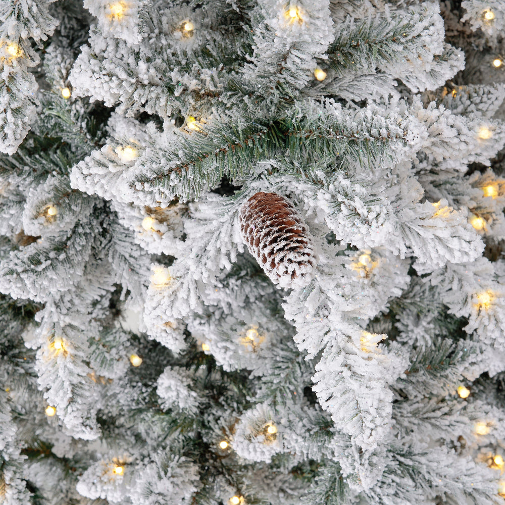 
                      
                        11’ Flocked Livingston Fir Artificial Christmas Tree with Pine Cones, 950 Clear Warm LED Lights and 3016 Bendable Branches
                      
                    