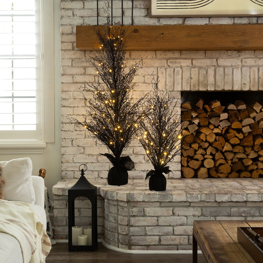 
                      
                        5’ Pre-Lit Halloween Black Twig Artificial Fall Tree in Burlap Planter with 85 Warm White LED Lights
                      
                    