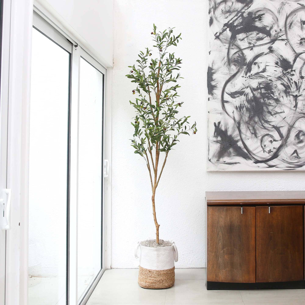 
                      
                        7’ Artificial Olive Tree with Natural Trunk and Handmade Jute Basket
                      
                    