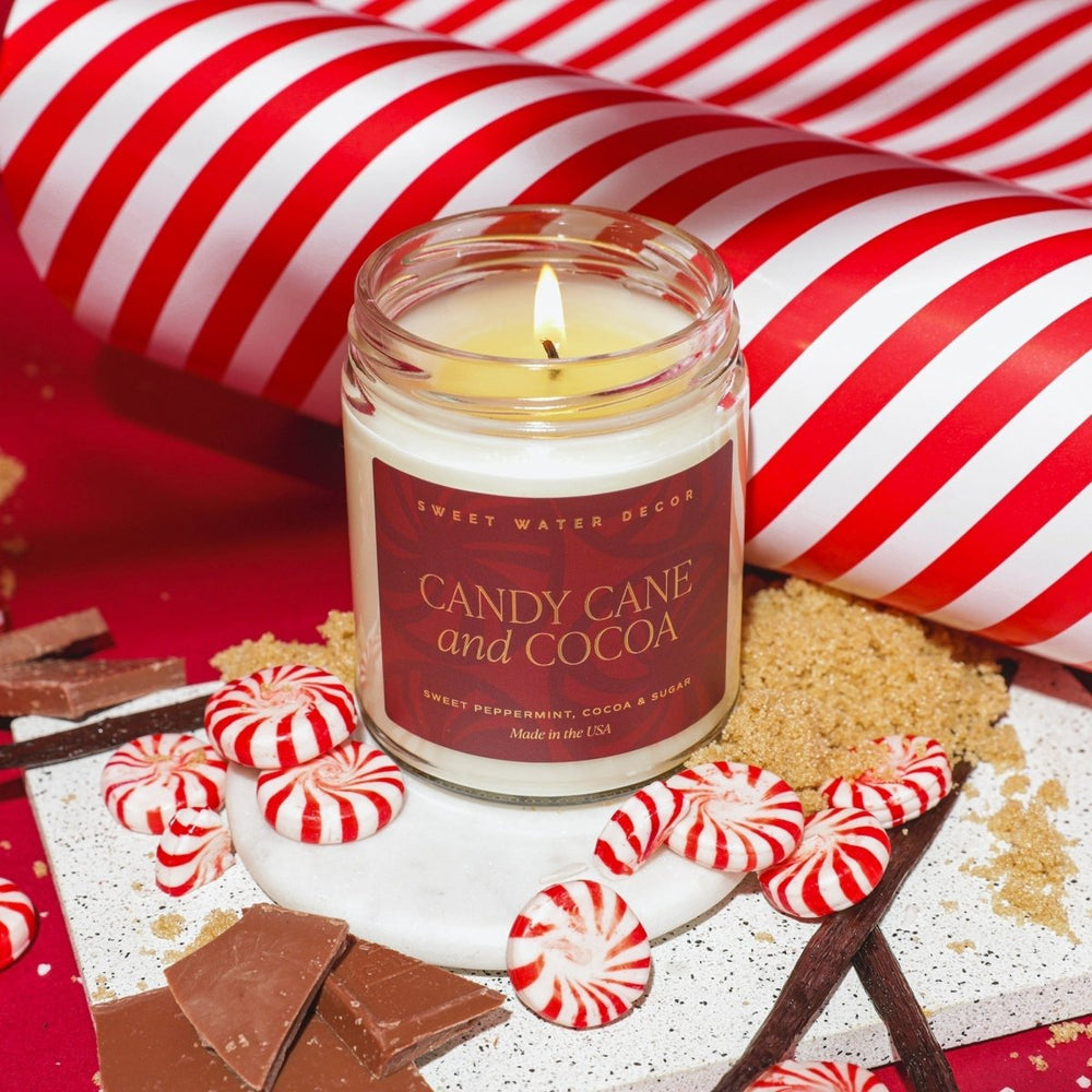 
                      
                        Sweet Water Decor Candy Cane and Cocoa Soy Candle - Clear Jar - 9 oz - lily & onyx
                      
                    