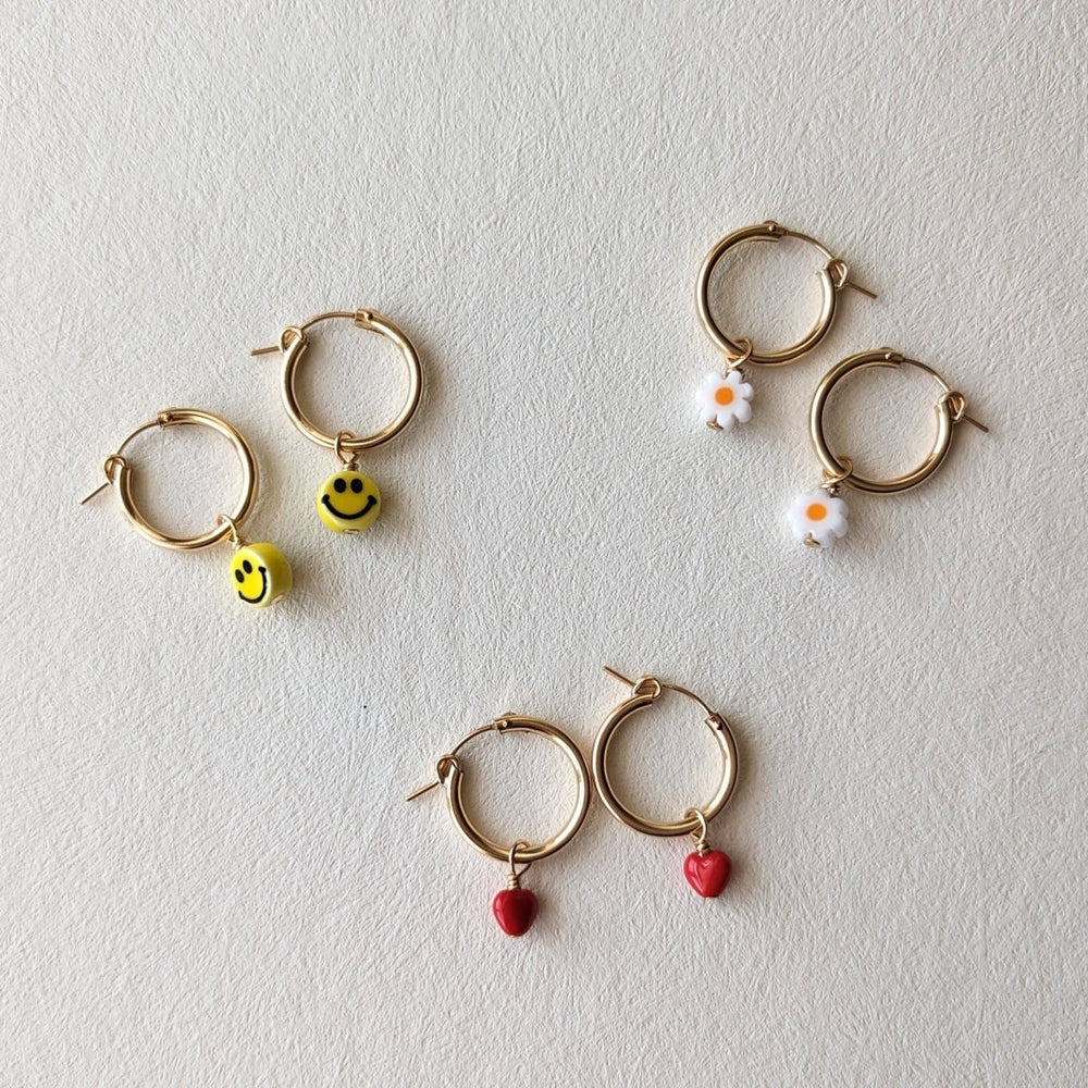 
                      
                        Pretti.Cool Charm Hoop Earrings | Daisies - lily & onyx
                      
                    