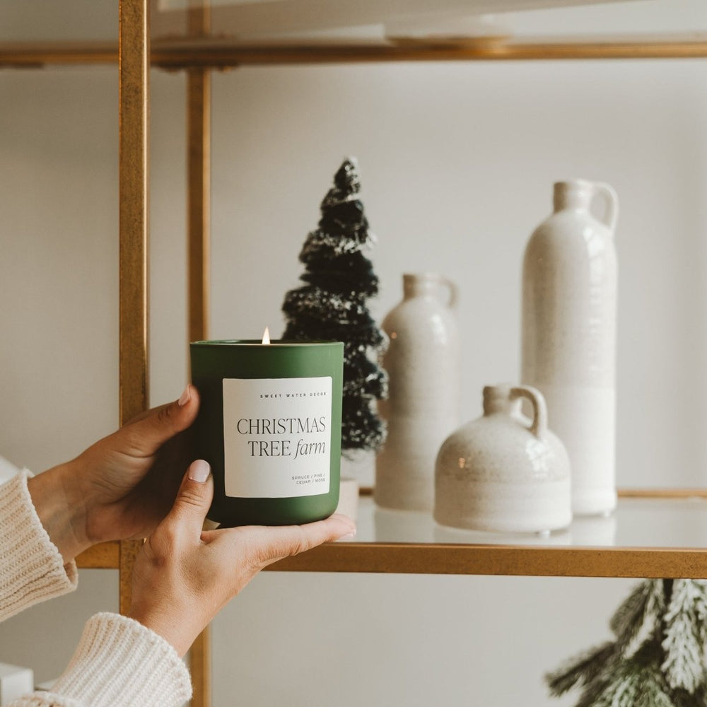 
                      
                        Sweet Water Decor Christmas Tree Farm Soy Candle - Green Matte Jar - 15 oz - lily & onyx
                      
                    