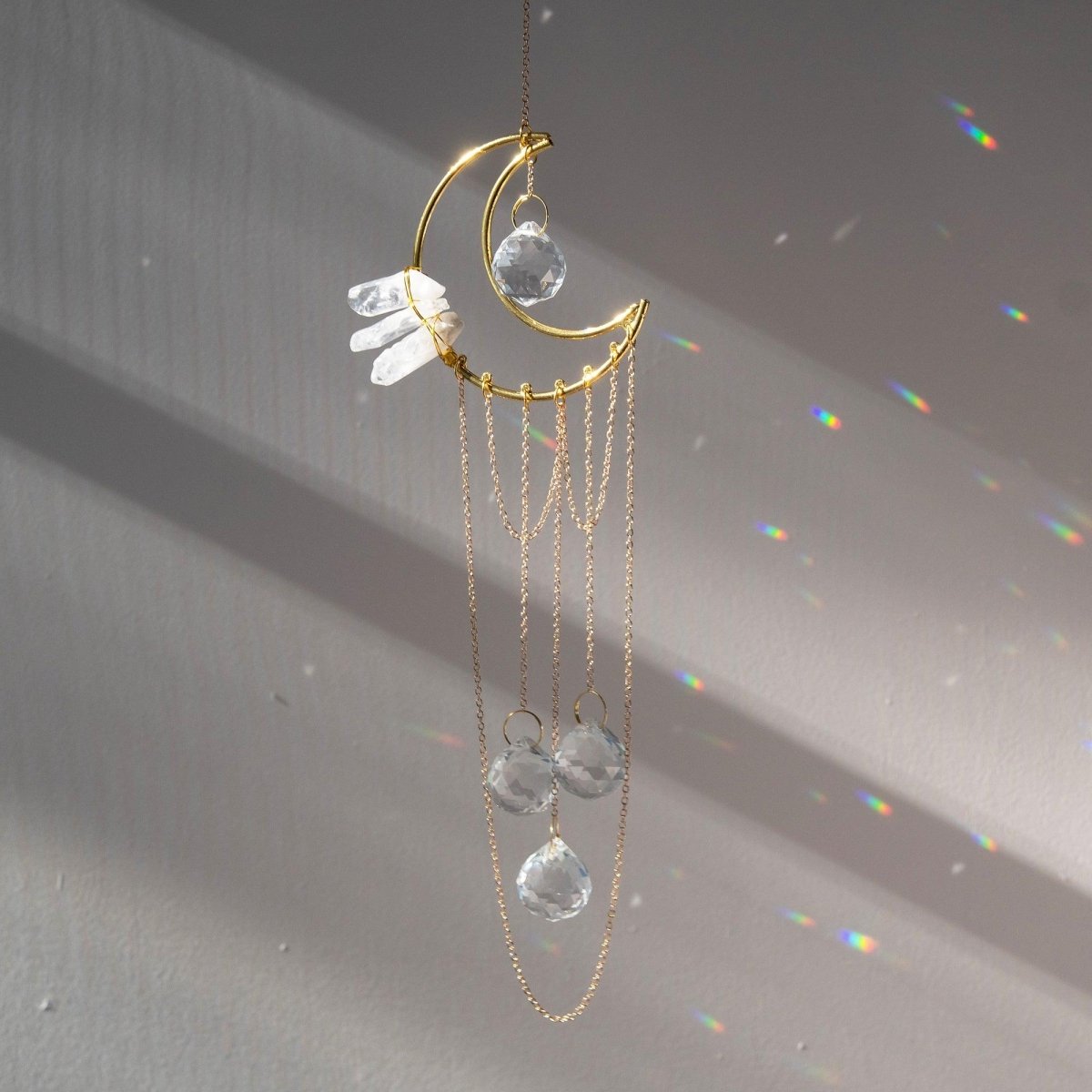 CEDAR AND MYRRH Crescent & Clear Quartz Suncatcher with Long Tassel