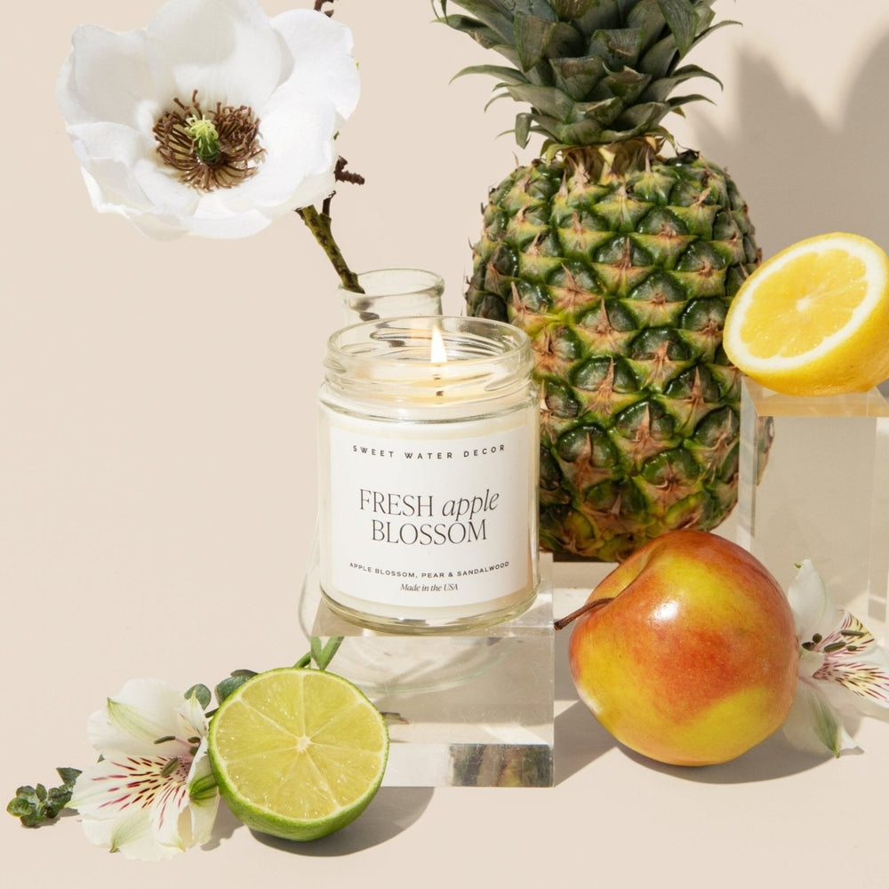 
                      
                        Sweet Water Decor Fresh Apple Blossom Soy Candle - Clear Jar - 9 oz - lily & onyx
                      
                    