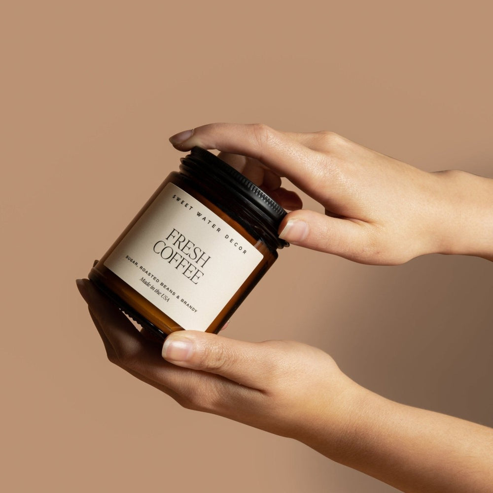 
                      
                        Sweet Water Decor Fresh Coffee Soy Candle - Amber Jar - 9 oz - lily & onyx
                      
                    