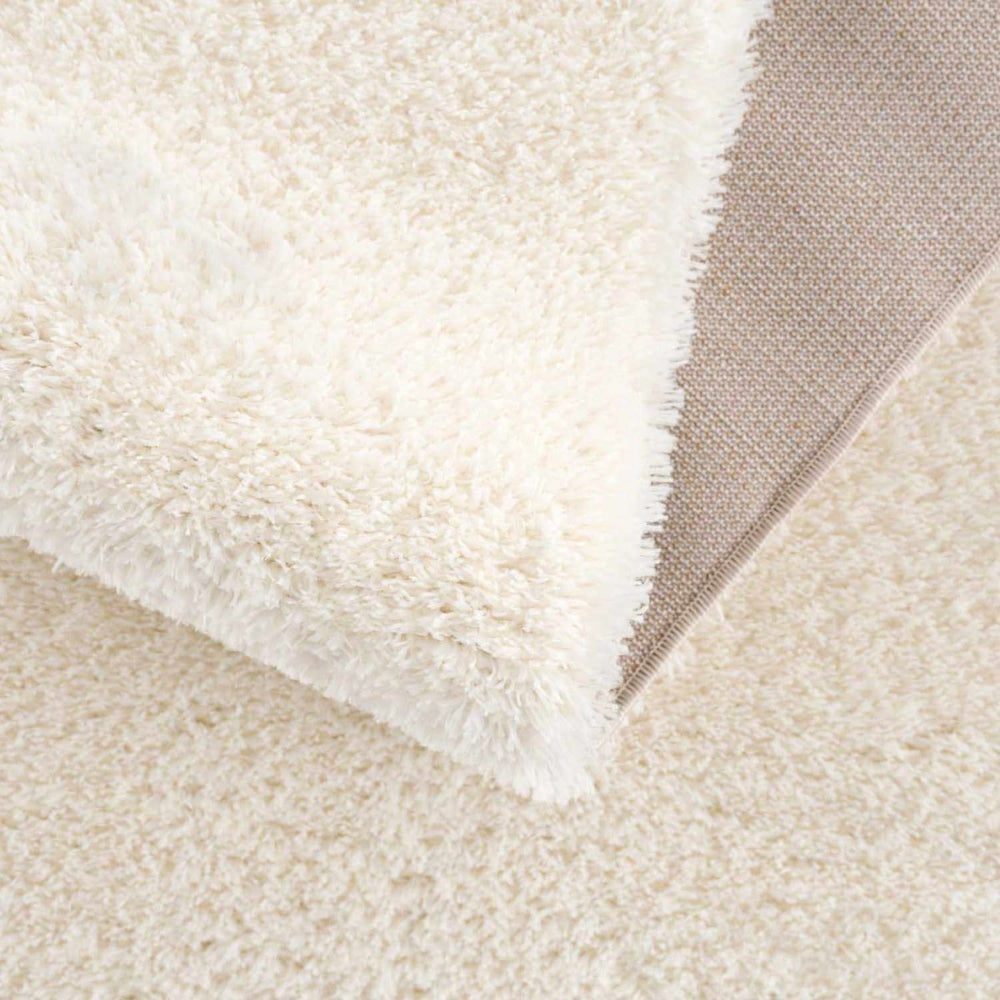 
                      
                        Hauteloom Heavenly Solid Cream Plush Rug - lily & onyx
                      
                    