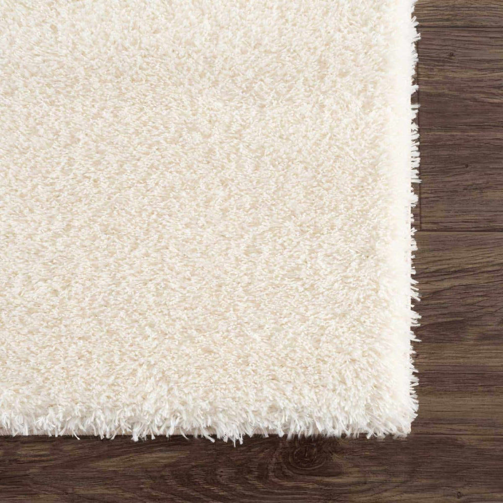 
                      
                        Hauteloom Heavenly Solid Cream Plush Rug - lily & onyx
                      
                    