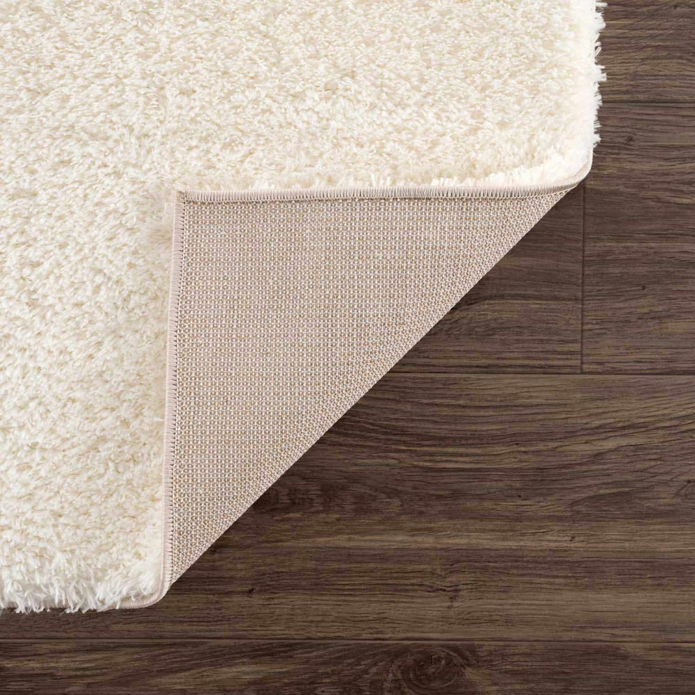 
                      
                        Hauteloom Heavenly Solid Cream Plush Rug - lily & onyx
                      
                    