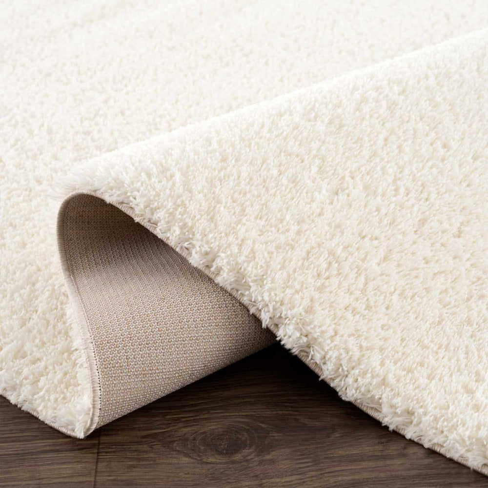 
                      
                        Hauteloom Heavenly Solid Cream Plush Rug - lily & onyx
                      
                    