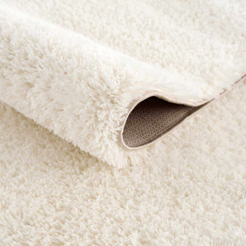 Hauteloom Heavenly Solid Cream Plush Rug - lily & onyx