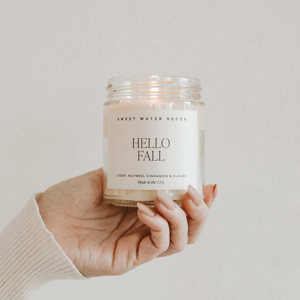
                      
                        Sweet Water Decor Hello Fall Soy Candle - Clear Jar - 9 oz - lily & onyx
                      
                    