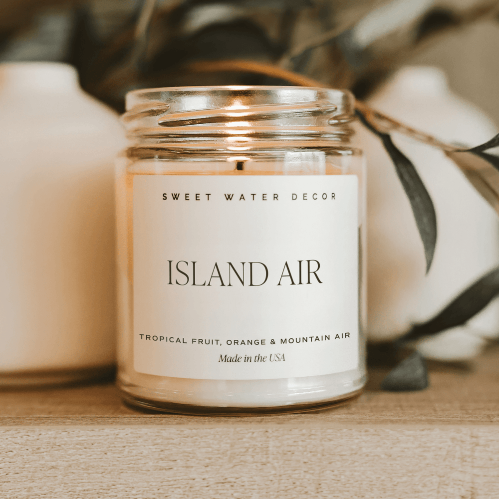 
                      
                        Sweet Water Decor Island Air Soy Candle - Clear Jar - 9 oz - lily & onyx
                      
                    