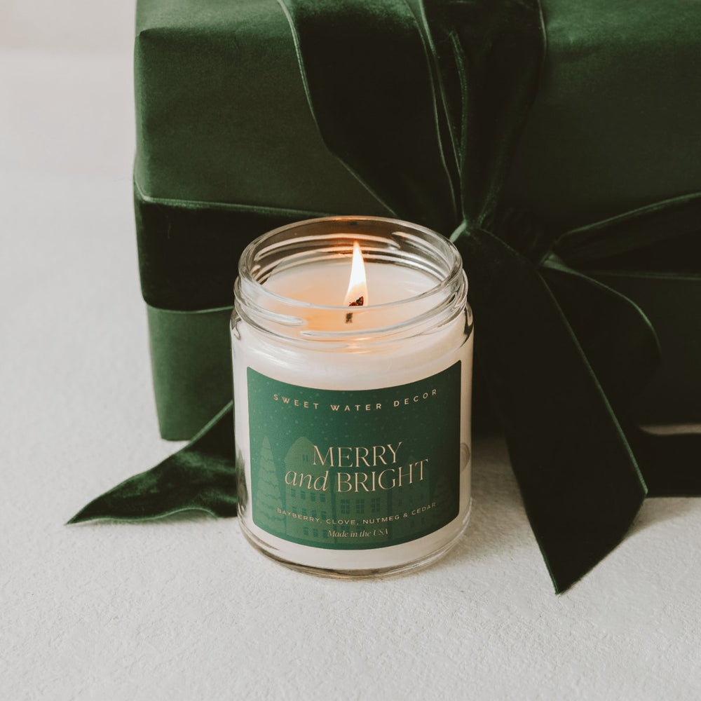 
                      
                        Sweet Water Decor Merry and Bright Soy Candle | 9oz. Clear Jar - lily & onyx
                      
                    