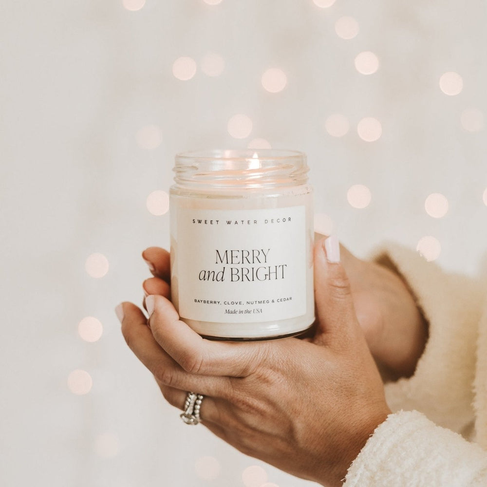 
                      
                        Sweet Water Decor Merry and Bright Soy Candle - Clear Jar - 9 oz - lily & onyx
                      
                    