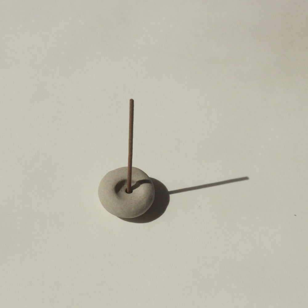 
                      
                        CEDAR AND MYRRH Mini Light Gray Ceramic Pebble Incense Holder - lily & onyx
                      
                    