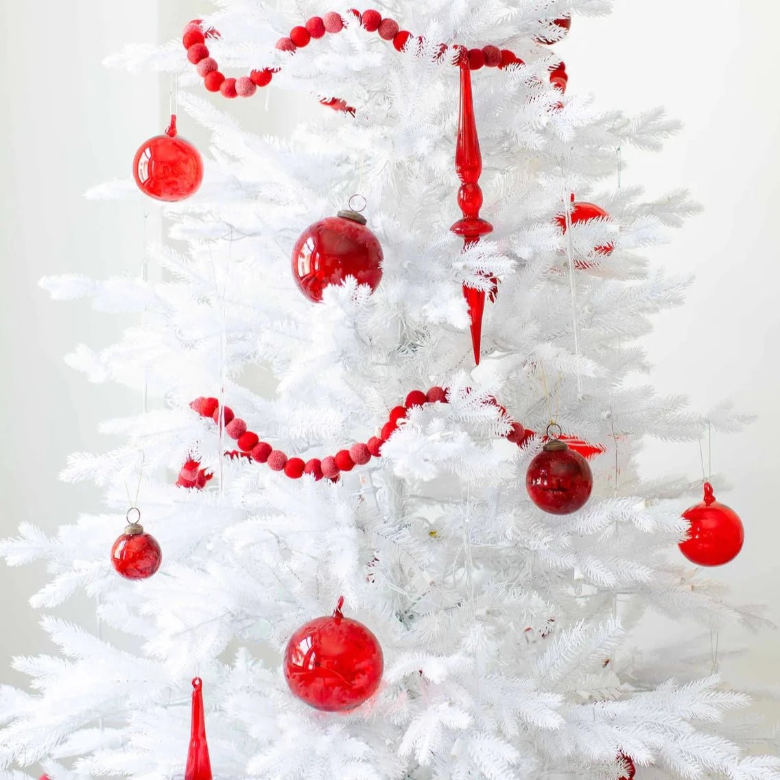 Moroah™ Red Glass Ornaments on white Christmas tree