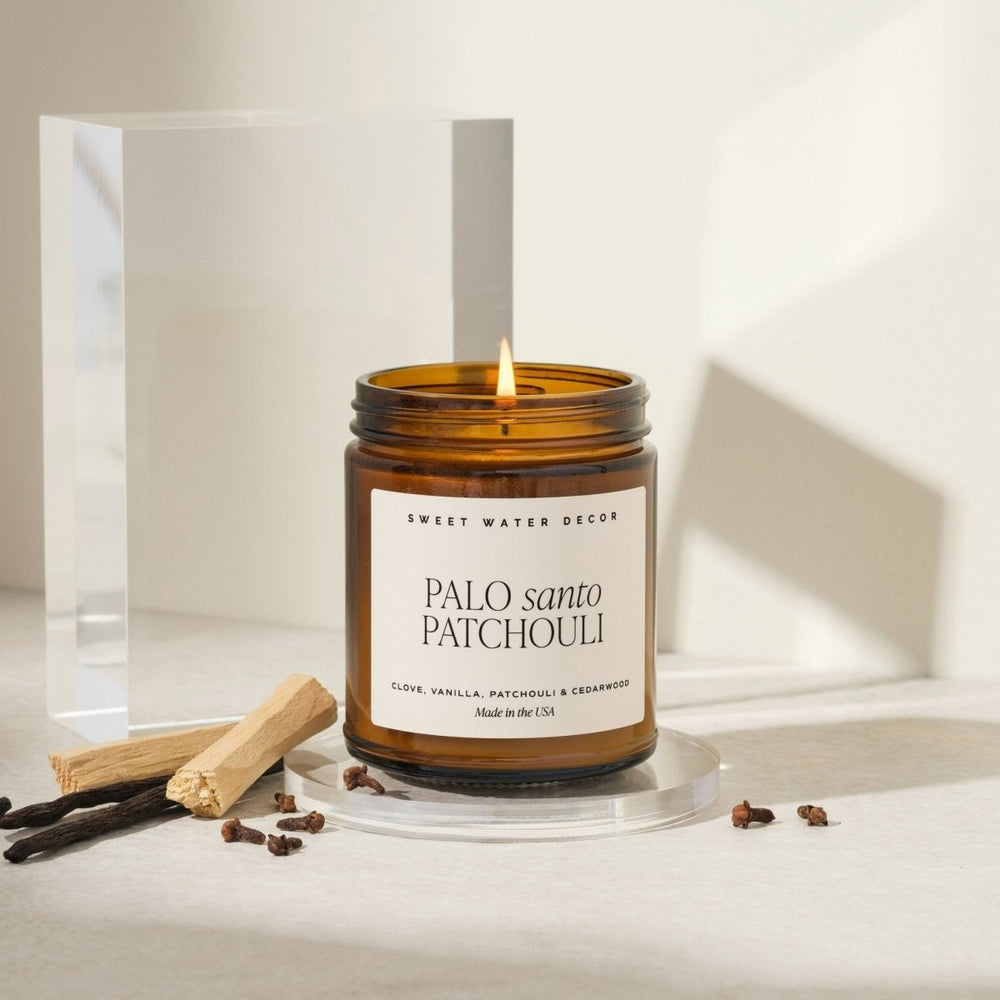 
                      
                        Sweet Water Decor Palo Santo Patchouli Soy Candle - Amber Jar - 9 oz - lily & onyx
                      
                    