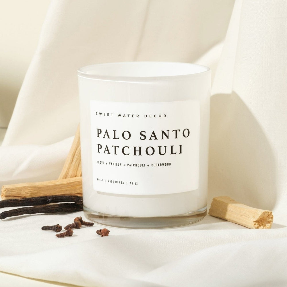 
                      
                        Sweet Water Decor Palo Santo Patchouli Soy Candle - White Jar - 11 oz - lily & onyx
                      
                    