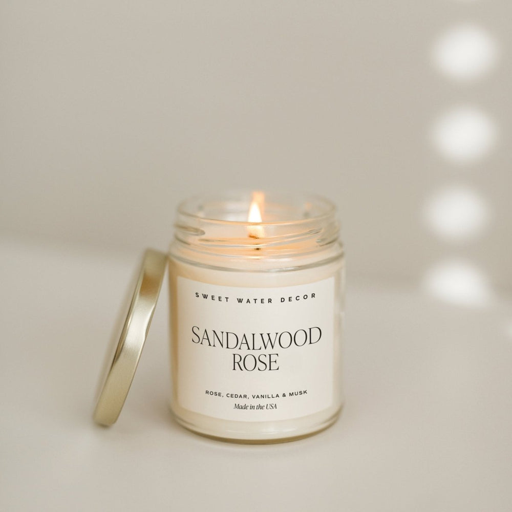 
                      
                        Sweet Water Decor Sandalwood Rose Soy Candle - Clear Jar - 9 oz - lily & onyx
                      
                    