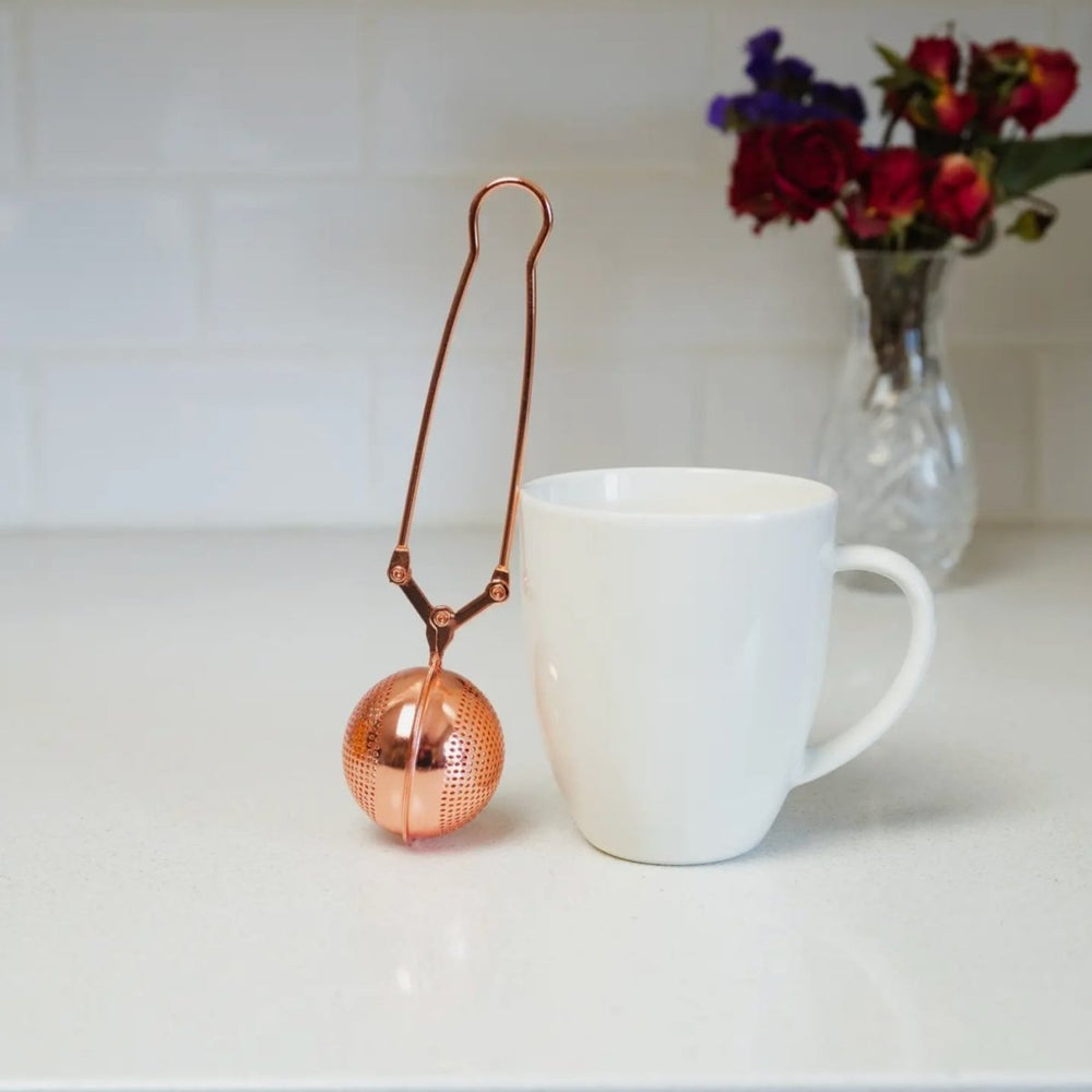 
                      
                        Bamboo Switch Tea Strainer Filter | Stainless Steel - lily & onyx
                      
                    