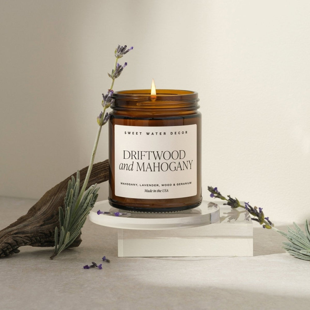
                      
                        Sweet Water Decor Teakwood and Mahogany Soy Candle - Amber Jar - 9 oz - lily & onyx
                      
                    