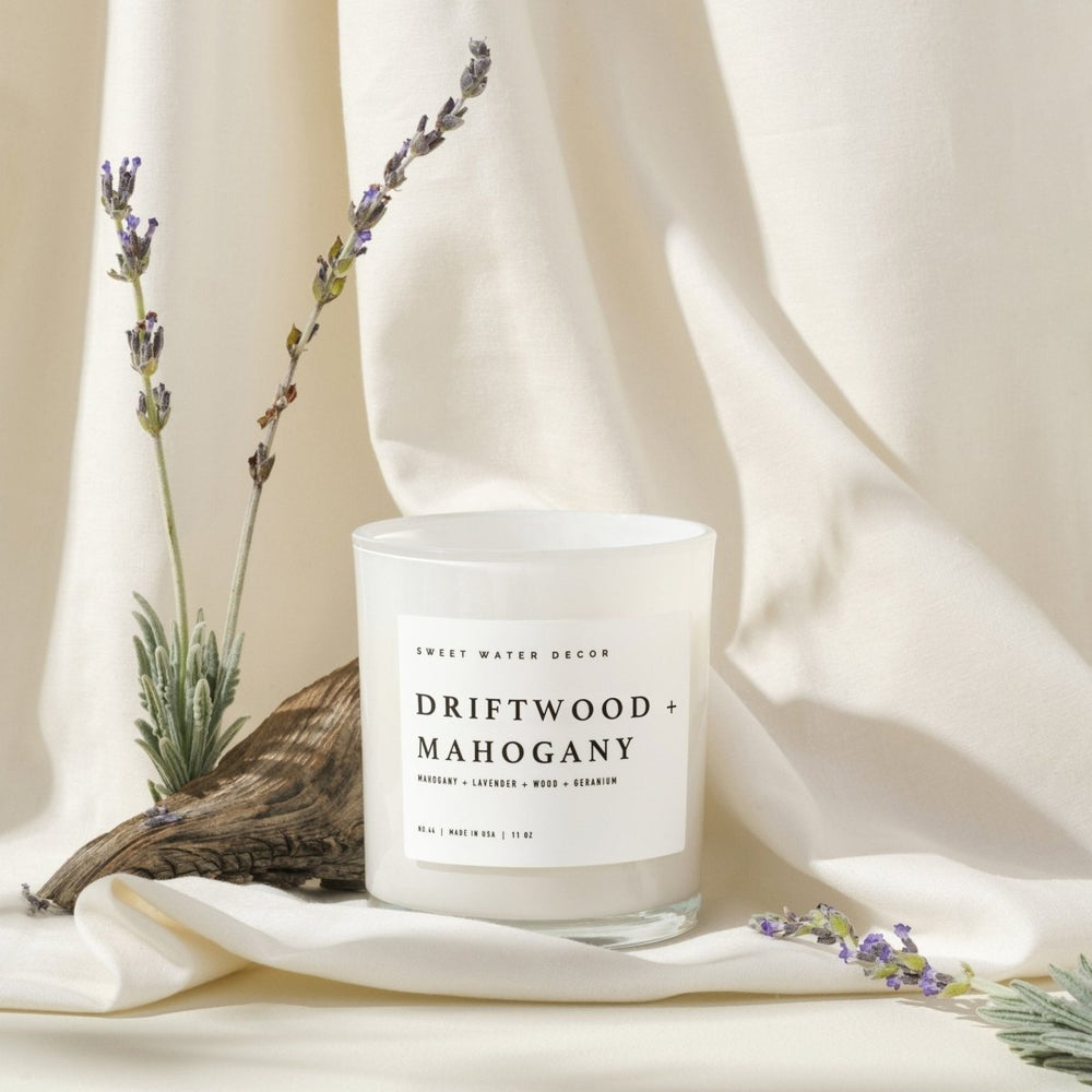 
                      
                        Sweet Water Decor Teakwood and Mahogany Soy Candle - White Jar - 11 oz - lily & onyx
                      
                    