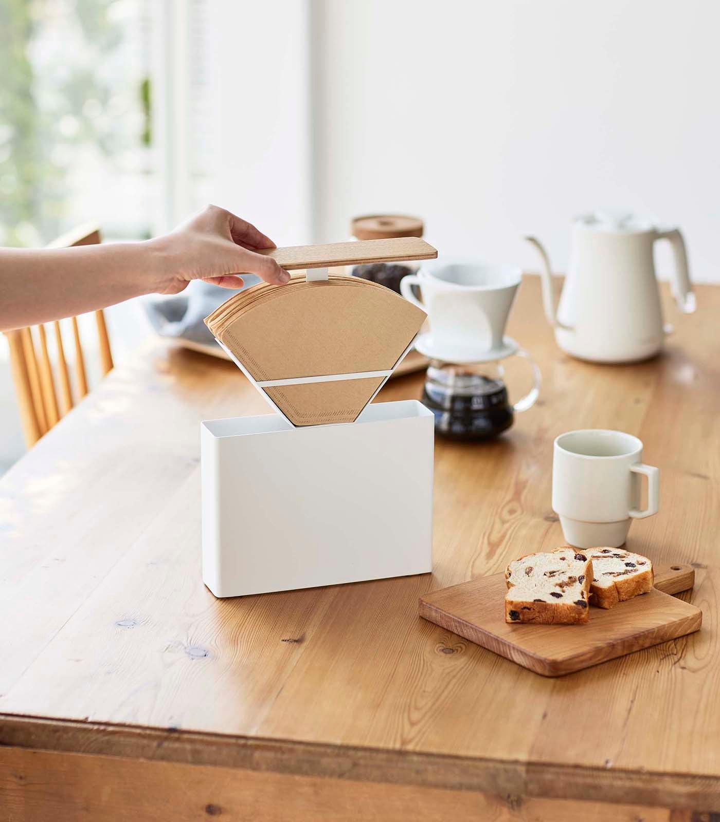 White plastic coffee filter case for size 4 filters by Yamazaki Home with a sleek, modern design.