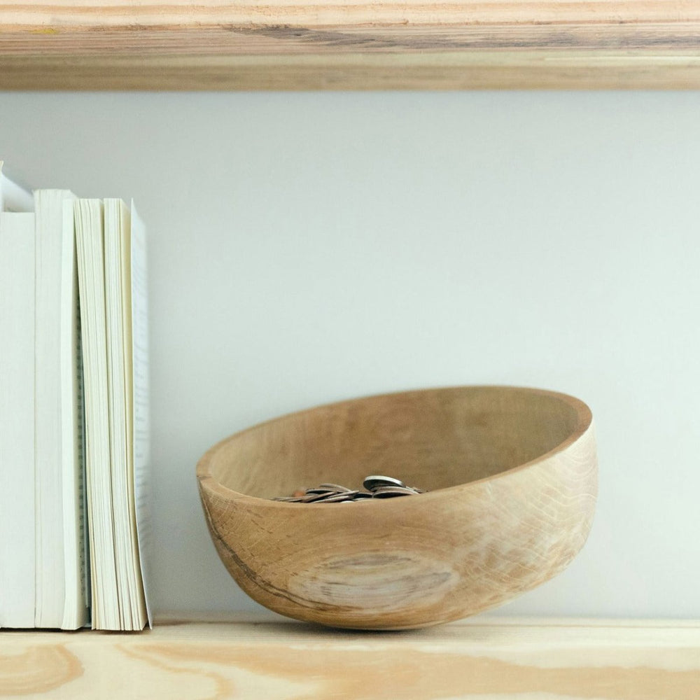 
                      
                        Axis Decorative Teak Bowl holding knick knacks sitting on shelf
                      
                    