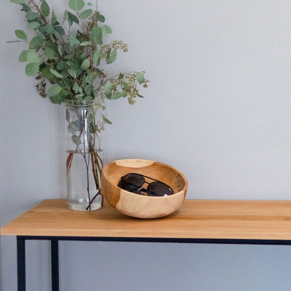 
                      
                        Axis Decorative Teak Bowl holding sunglasses next to vase of greenery on wooden console table
                      
                    
