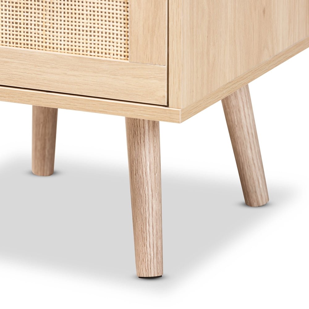 
                      
                        Baxton Studio Baird Mid Century Modern Light Oak Brown Finished Wood And Rattan 2 Drawer Nightstand - lily & onyx
                      
                    
