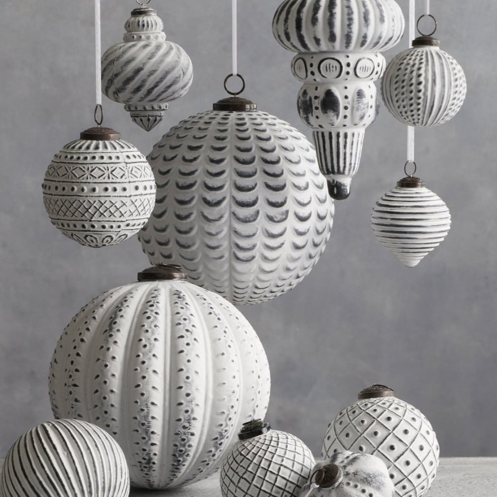 An assortment of Breckenridge™ 8 Inch Glass Ornaments in varying styles