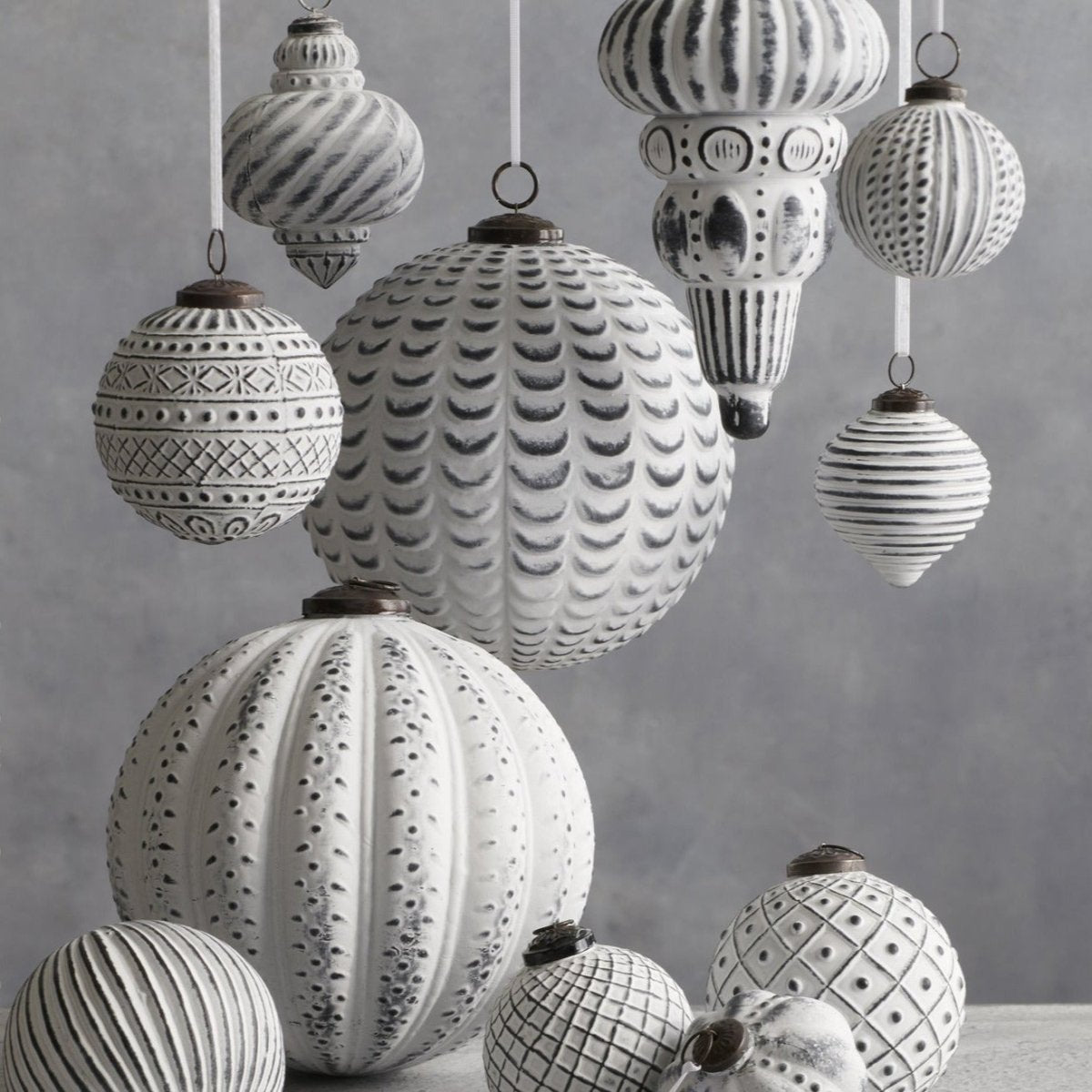 An assortment of Breckenridge™ 8 Inch Glass Ornaments in varying styles