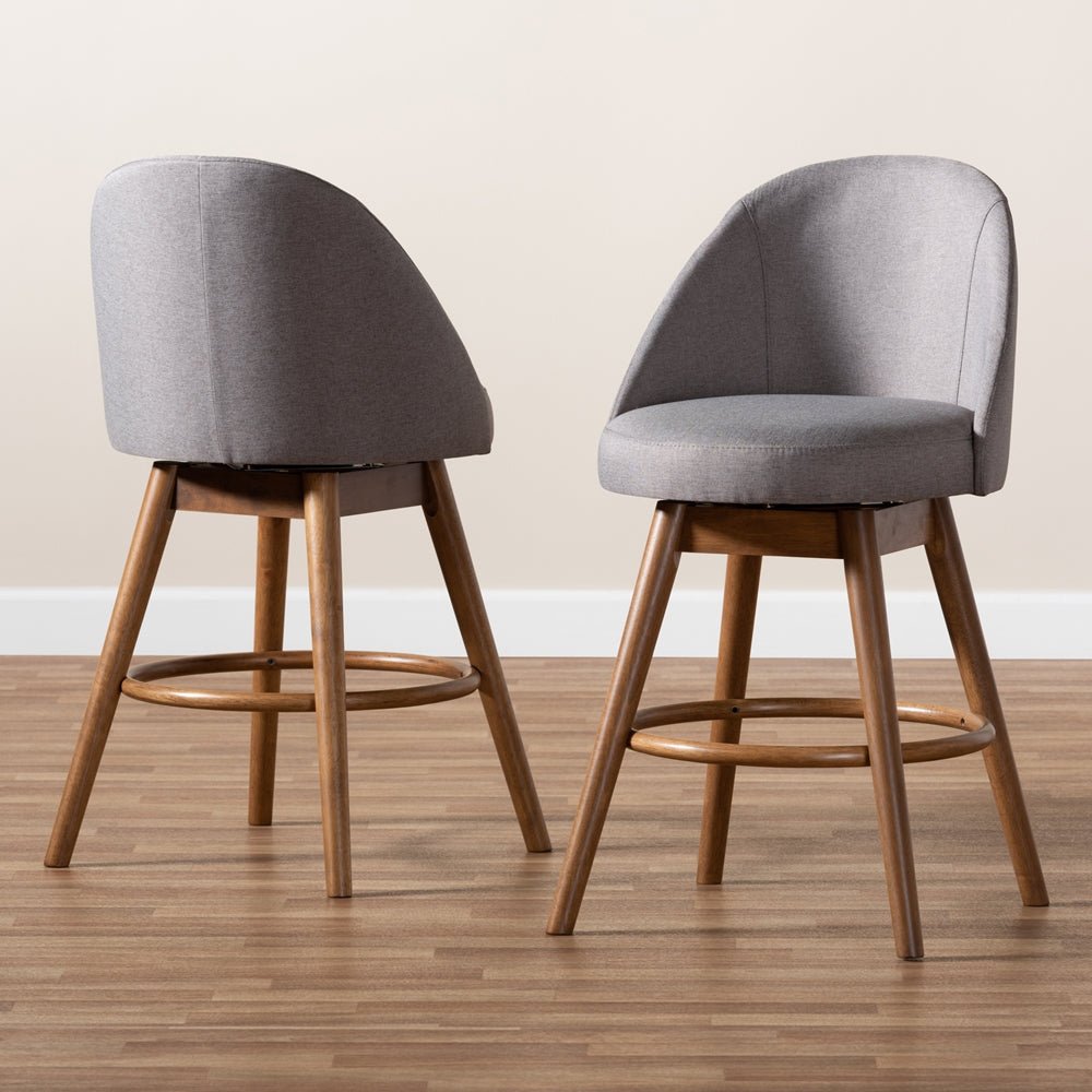 
                      
                        Baxton Studio Carra Mid-Century Modern Fabric Upholstered Walnut-Finished Wood Swivel Counter Stool (Set of 2) - lily & onyx
                      
                    