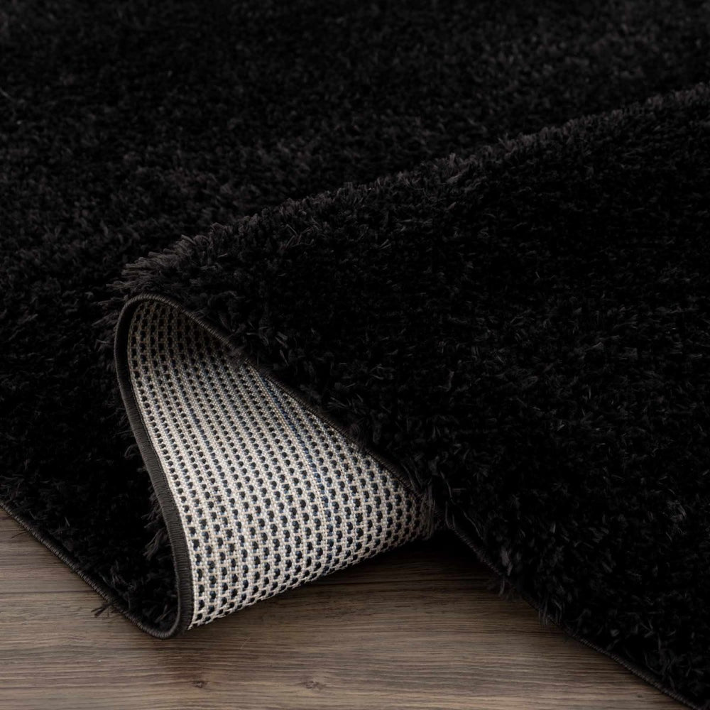 
                      
                        Hauteloom Faina Solid Black Washable Shag Rug - lily & onyx
                      
                    