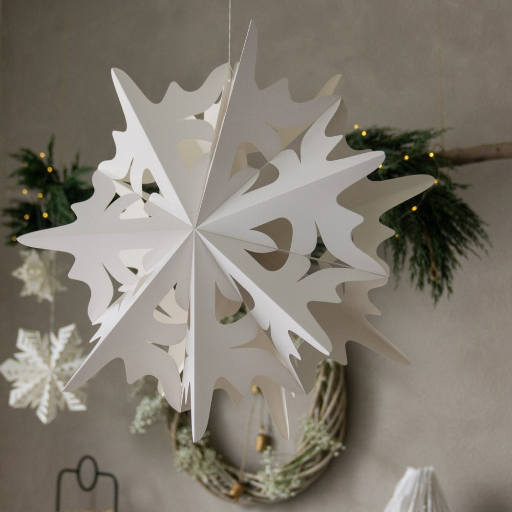 
                      
                        A close up of a Flurry™ Hanging paper Snowflake - Crystal
                      
                    