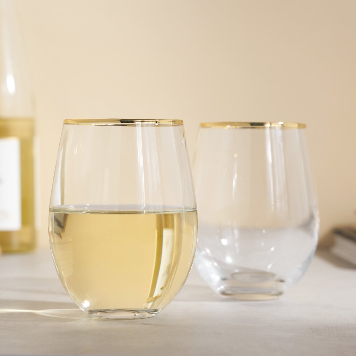 https://lilyandonyx.com/cdn/shop/products/gilded-stemless-wine-glass-set-of-2-483410_1445x.jpg?v=1666388765