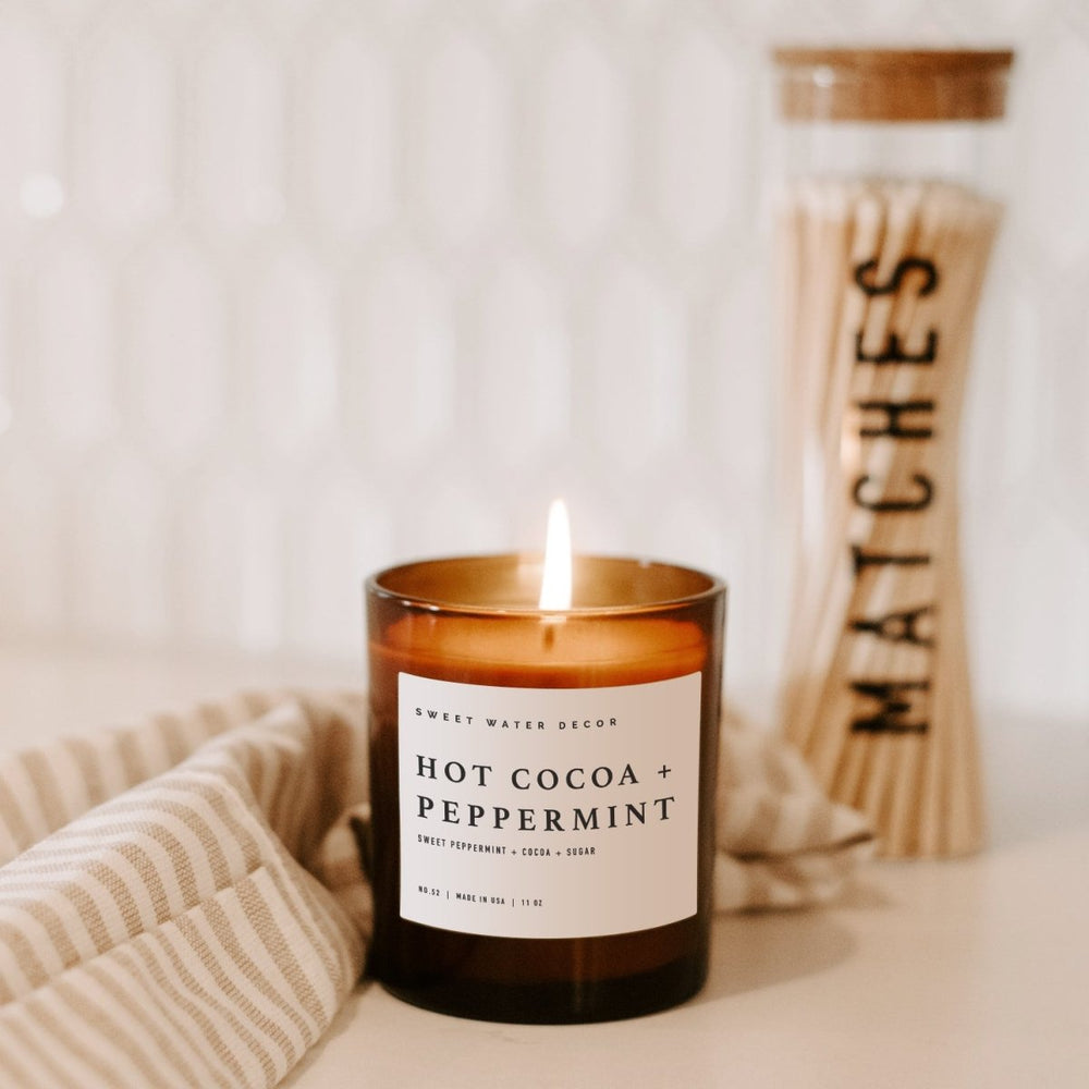 
                      
                        Sweet Water Decor Hot Cocoa and Peppermint Soy Candle - Amber Jar - 11 oz - lily & onyx
                      
                    